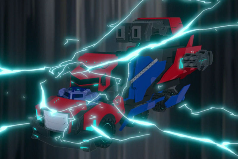 File:CollateralDamage Hi-Test powers up Optimus.jpg